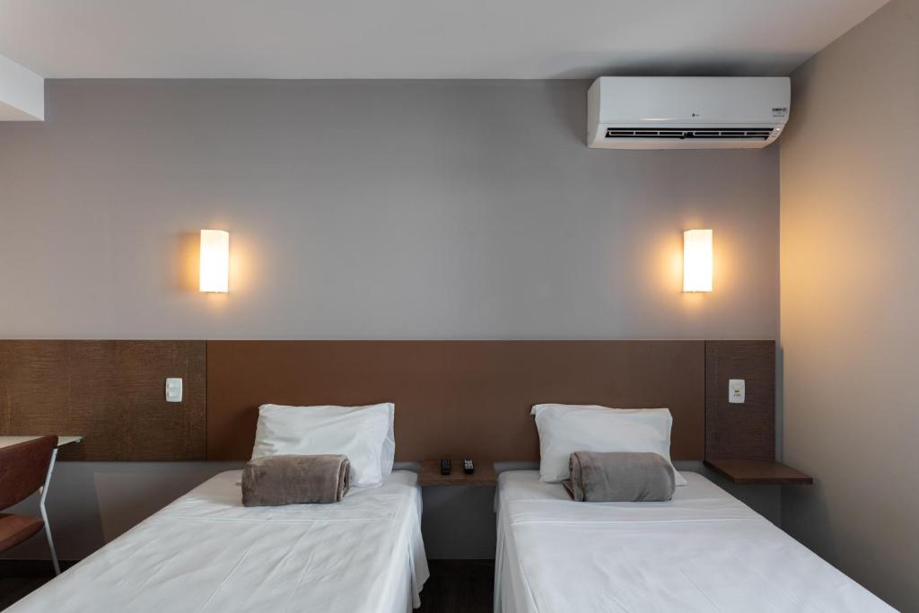 Postel nebo postele na pokoji v ubytování Go Inn Hotel Curitiba