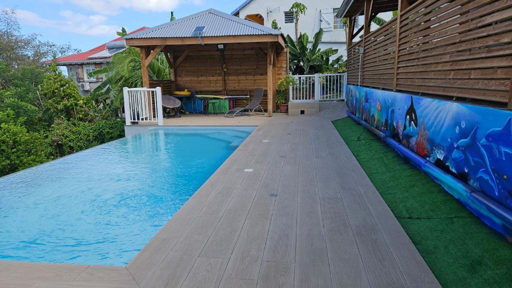 LES GITES D'ANGELE- Gîtes calme avec piscine, vue sur mer & jardin tropical - Casa De Dos Dormitorios