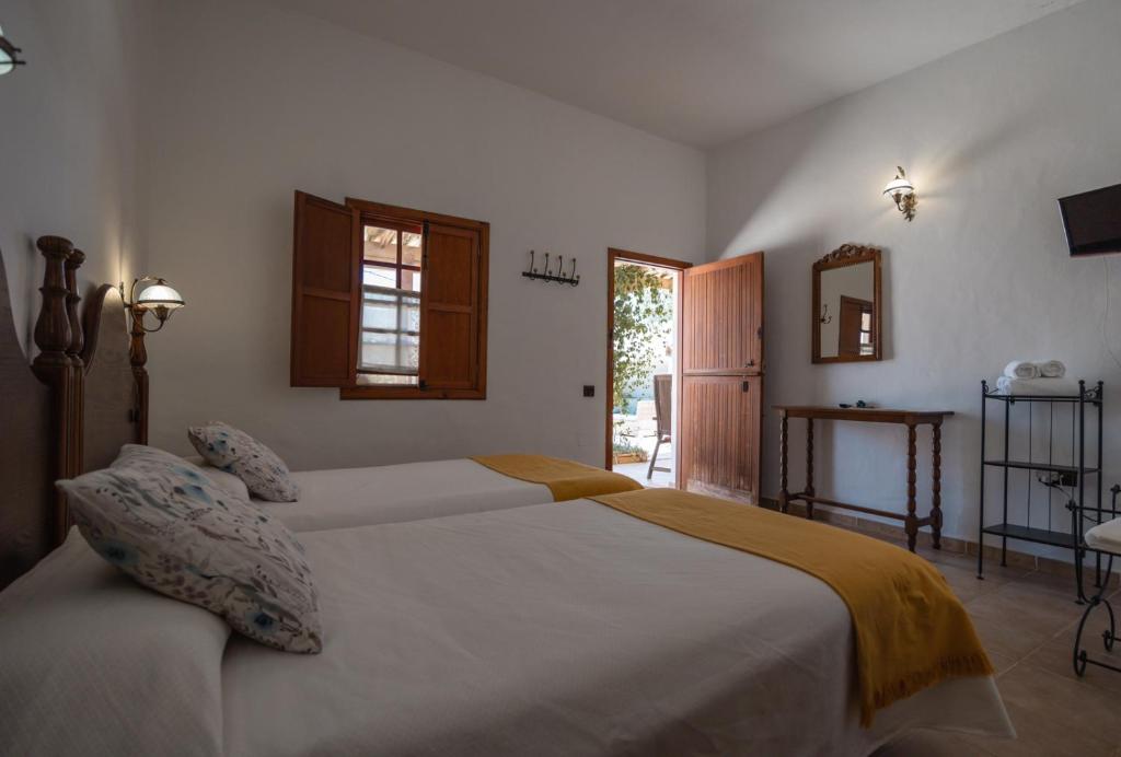 Posteľ alebo postele v izbe v ubytovaní Hotel Rural Era de la Corte - Adults only