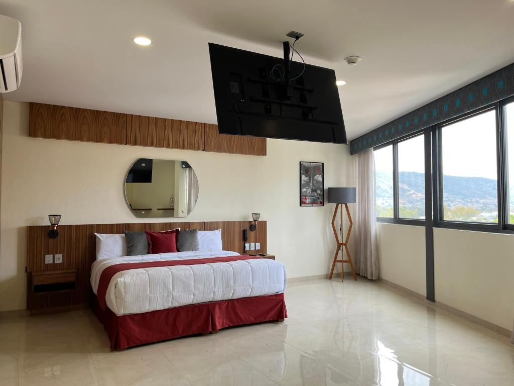 Postel nebo postele na pokoji v ubytování Hotel Cinco Diamantes
