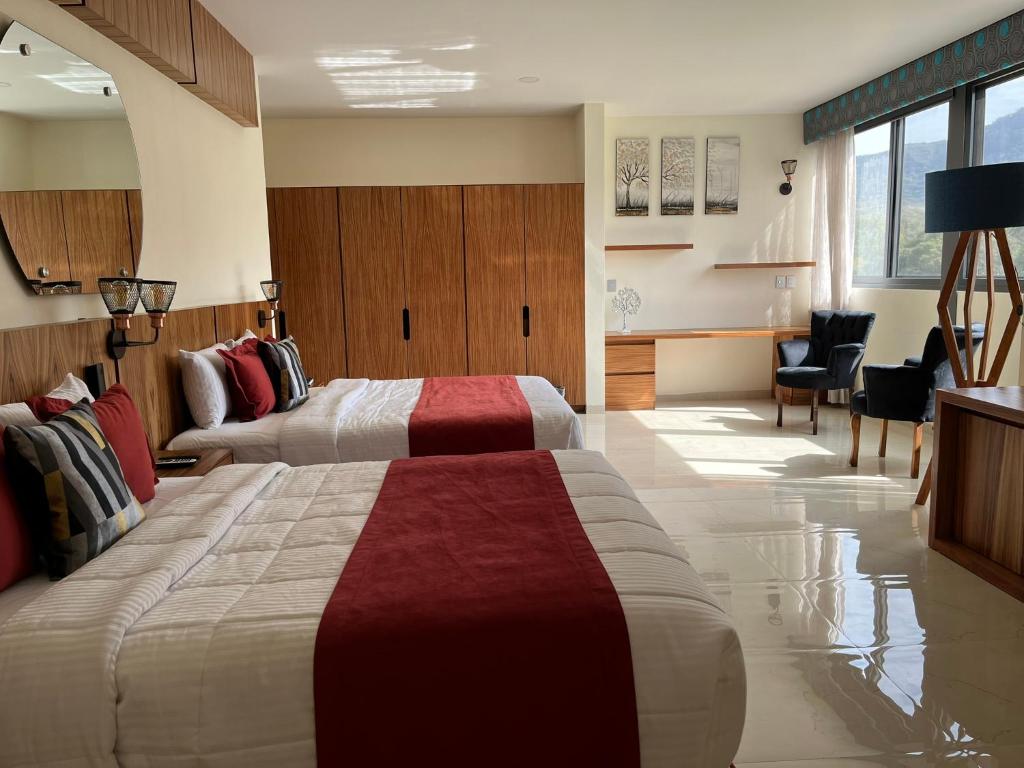 Postel nebo postele na pokoji v ubytování Hotel Cinco Diamantes