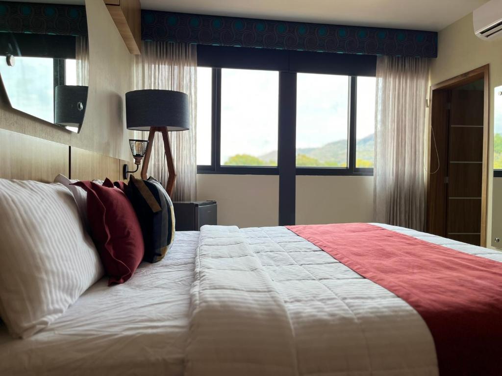 Postel nebo postele na pokoji v ubytování Hotel Cinco Diamantes