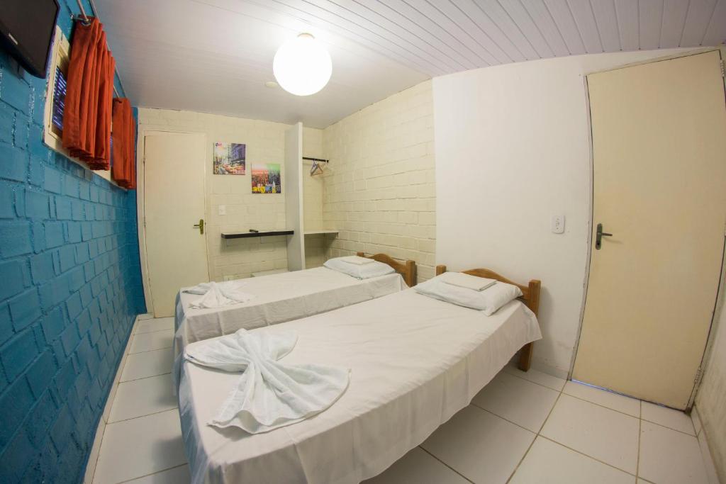 Postel nebo postele na pokoji v ubytování Cosmopolitan Hostel