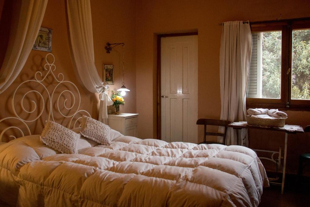 Postel nebo postele na pokoji v ubytování Hostería San Martin