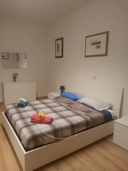 a bedroom with a bed with a stuffed animal on it at Casa Iris in La Spezia