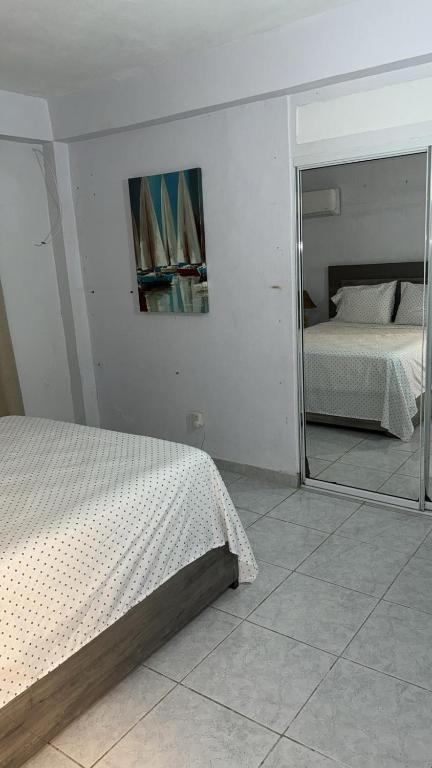 Postel nebo postele na pokoji v ubytování Playa Apartments