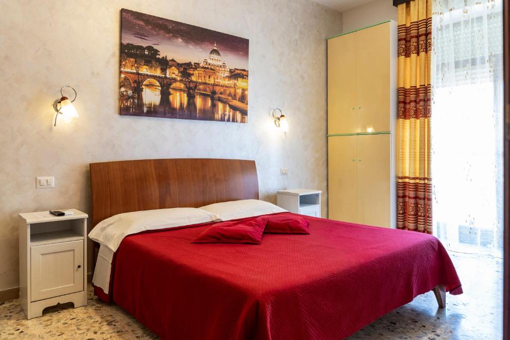 A bed or beds in a room at La Stazione Del Vaticano