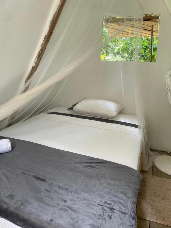Postel nebo postele na pokoji v ubytování Cascada escondida glamping