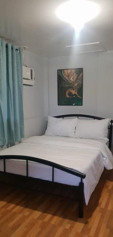 Postel nebo postele na pokoji v ubytování Baybayon ni Tata Joven Resort