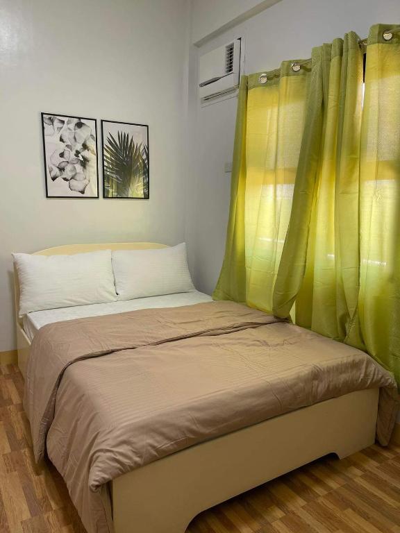 Postel nebo postele na pokoji v ubytování Baybayon ni Tata Joven Resort