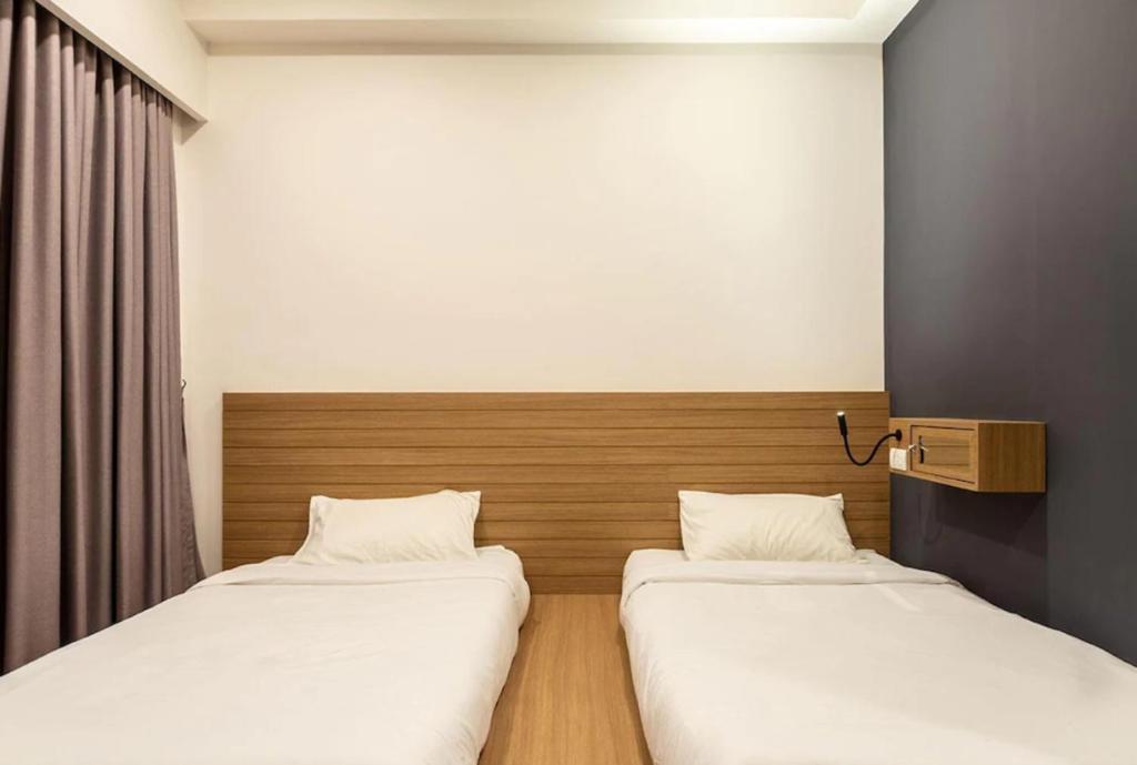 Postel nebo postele na pokoji v ubytování Kata Beach Poshtel Phuket