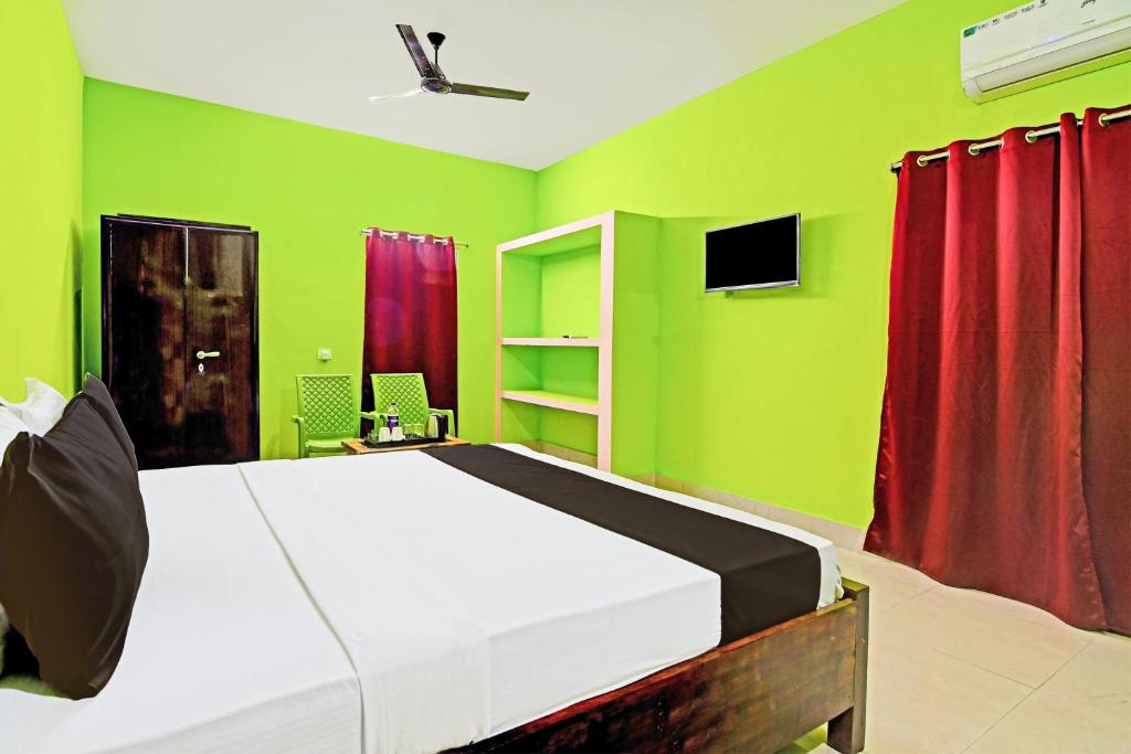 TV a/nebo společenská místnost v ubytování Super Hotel O Khushi Guest House