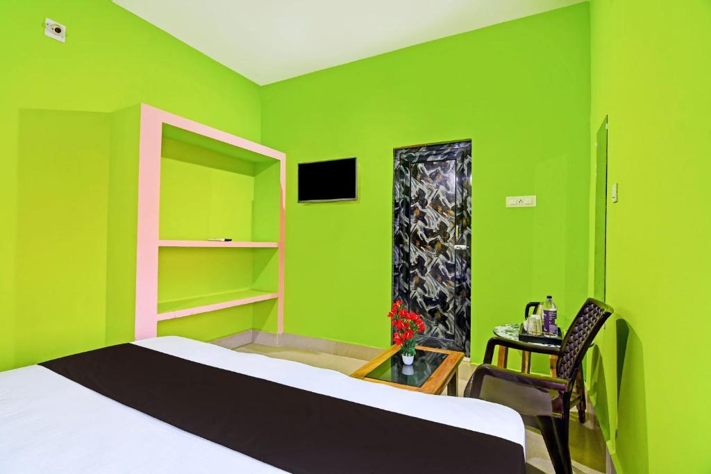 Postel nebo postele na pokoji v ubytování Super Hotel O Khushi Guest House