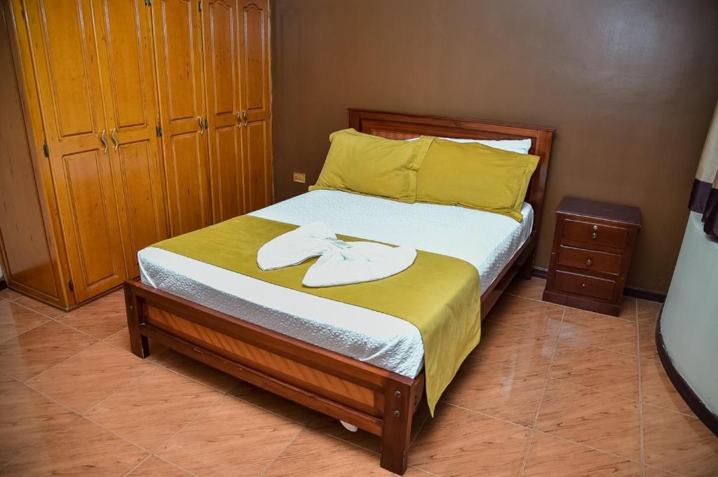 Postel nebo postele na pokoji v ubytování Hotel Miraflores
