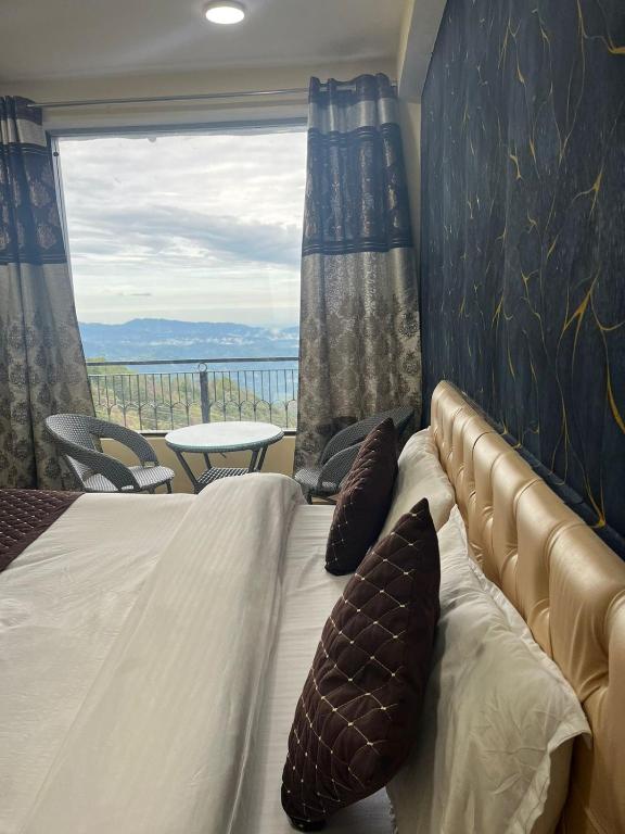 Postel nebo postele na pokoji v ubytování Amor Haven & Dine