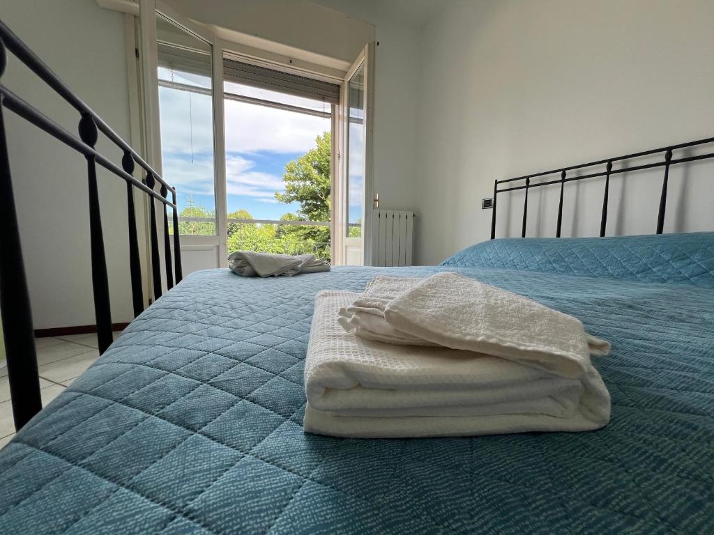 Postel nebo postele na pokoji v ubytování O&R Home Crema