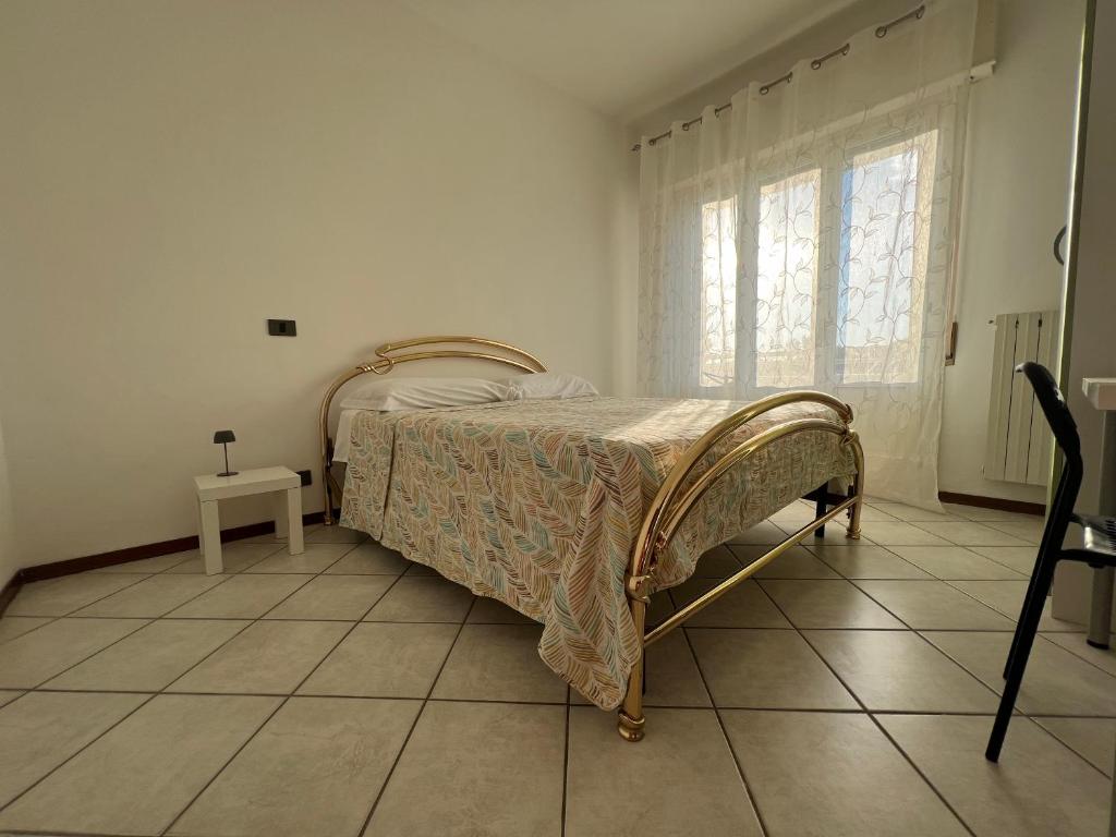 Postel nebo postele na pokoji v ubytování O&R Home Crema