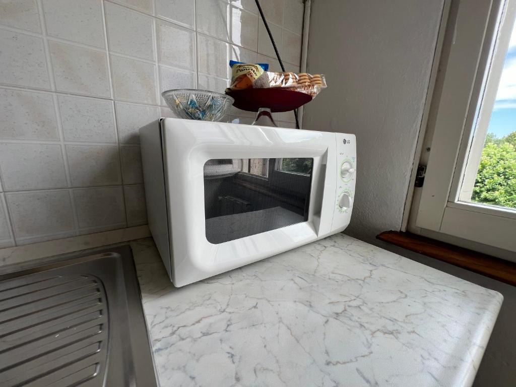 Kuchyň nebo kuchyňský kout v ubytování O&R Home Crema