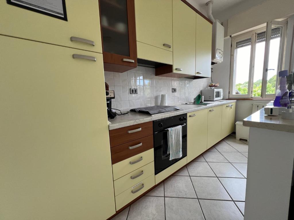 Kuchyň nebo kuchyňský kout v ubytování O&R Home Crema