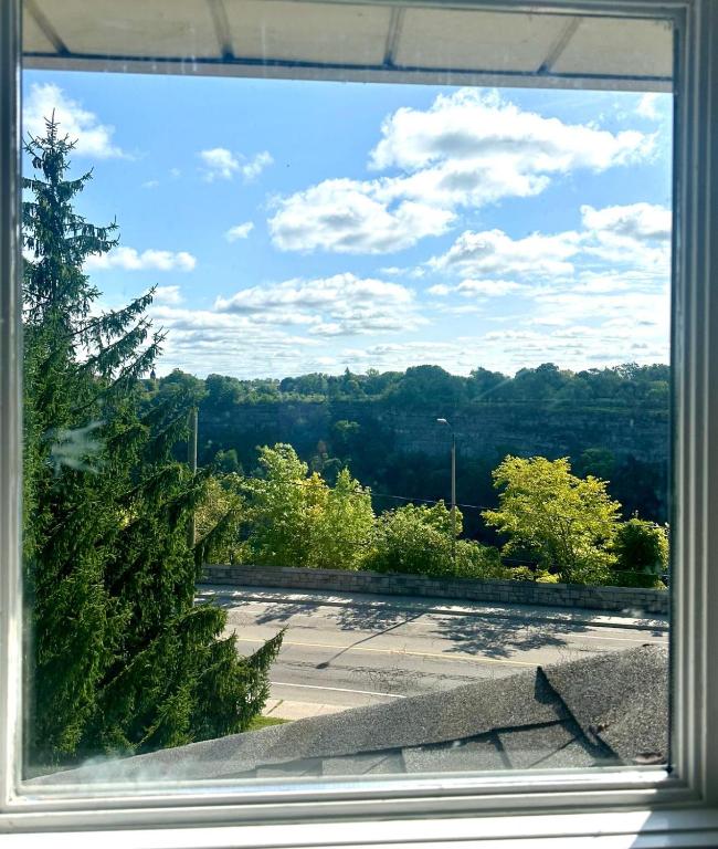 a view of a parking lot through a window at Butterfly Manor in Niagara Falls
