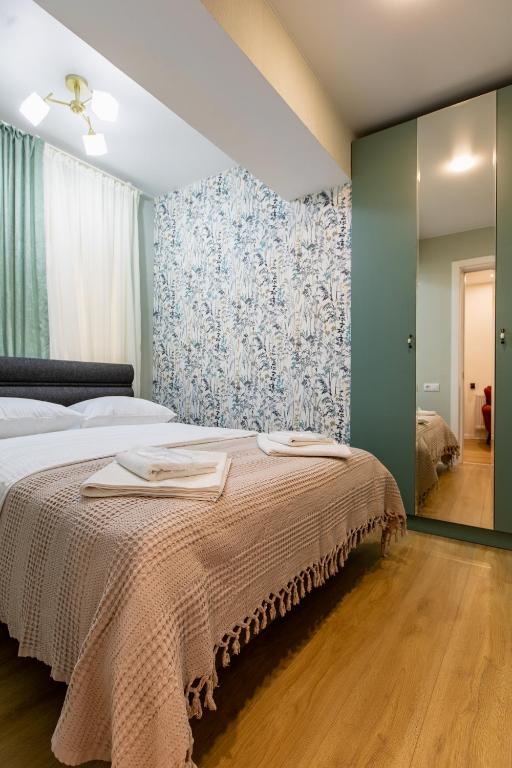 Llit o llits en una habitació de Guesthouse of Manoni Ratiani