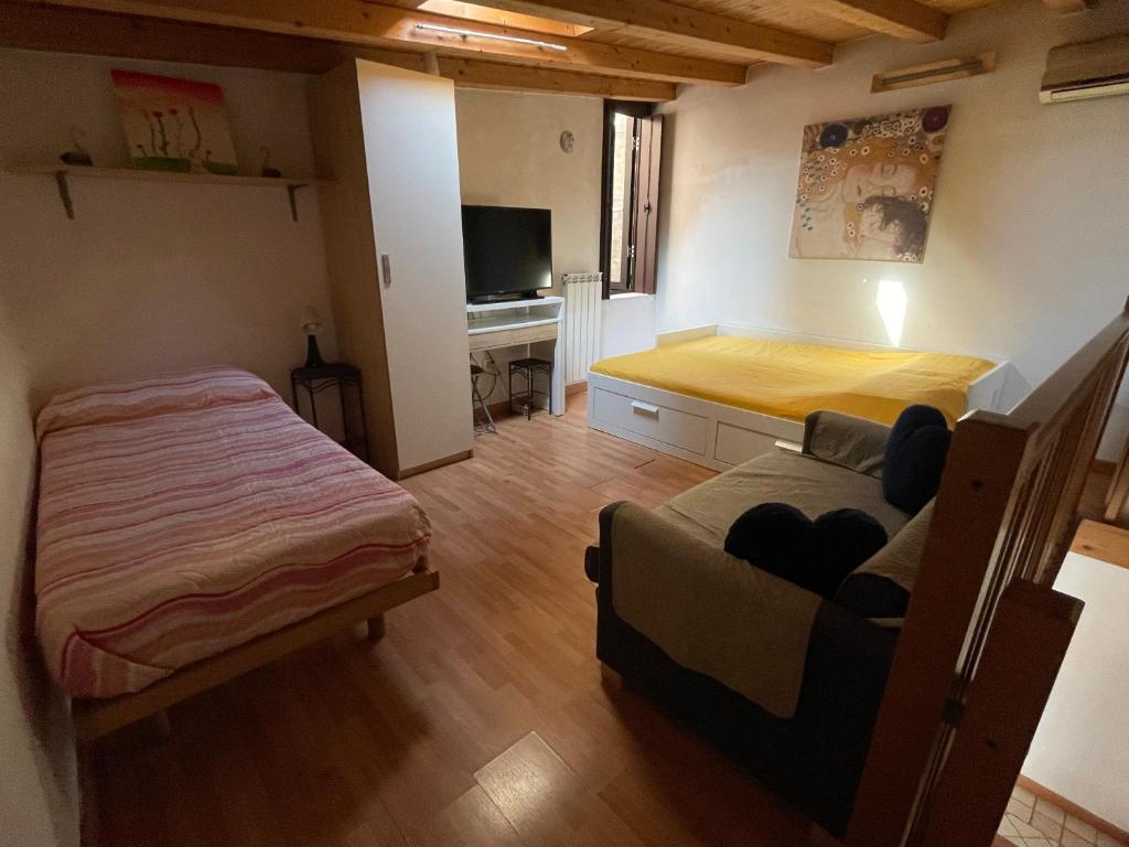 Łóżko lub łóżka w pokoju w obiekcie Cà Batuffolin