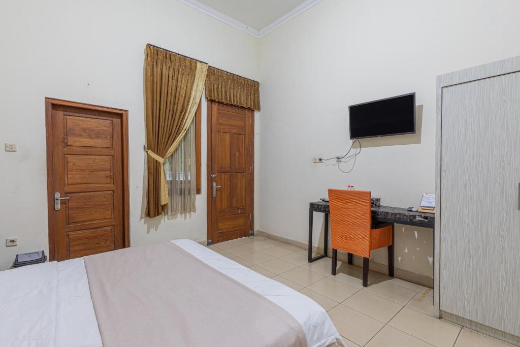TV a/nebo společenská místnost v ubytování Pondok Gajah Hotel