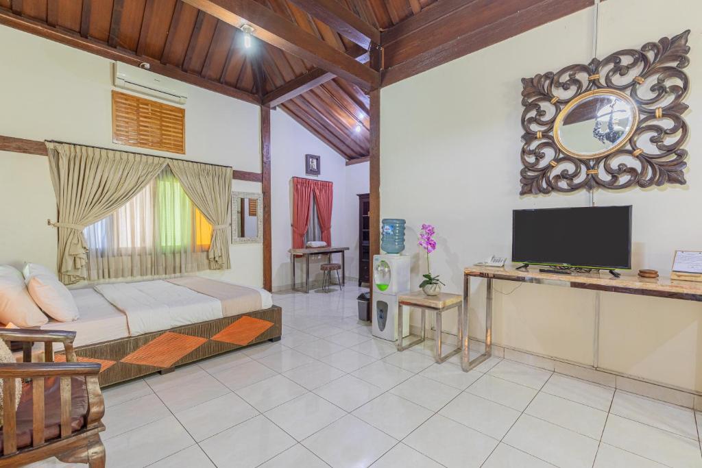 TV a/nebo společenská místnost v ubytování Pondok Gajah Hotel