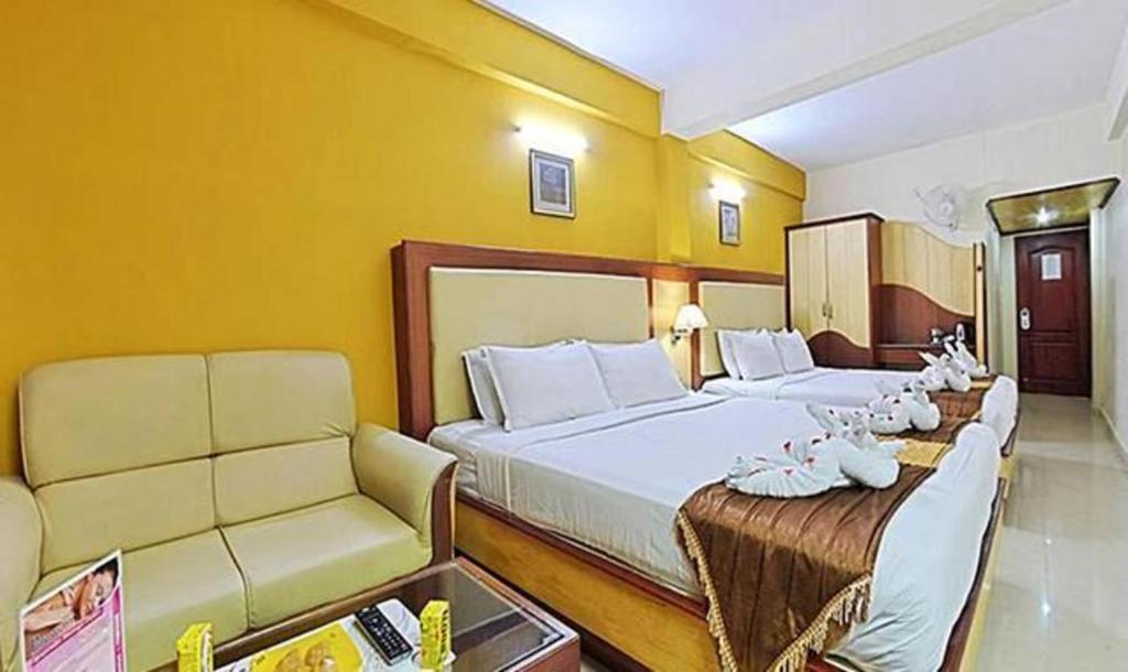 Postel nebo postele na pokoji v ubytování PonmariResidency