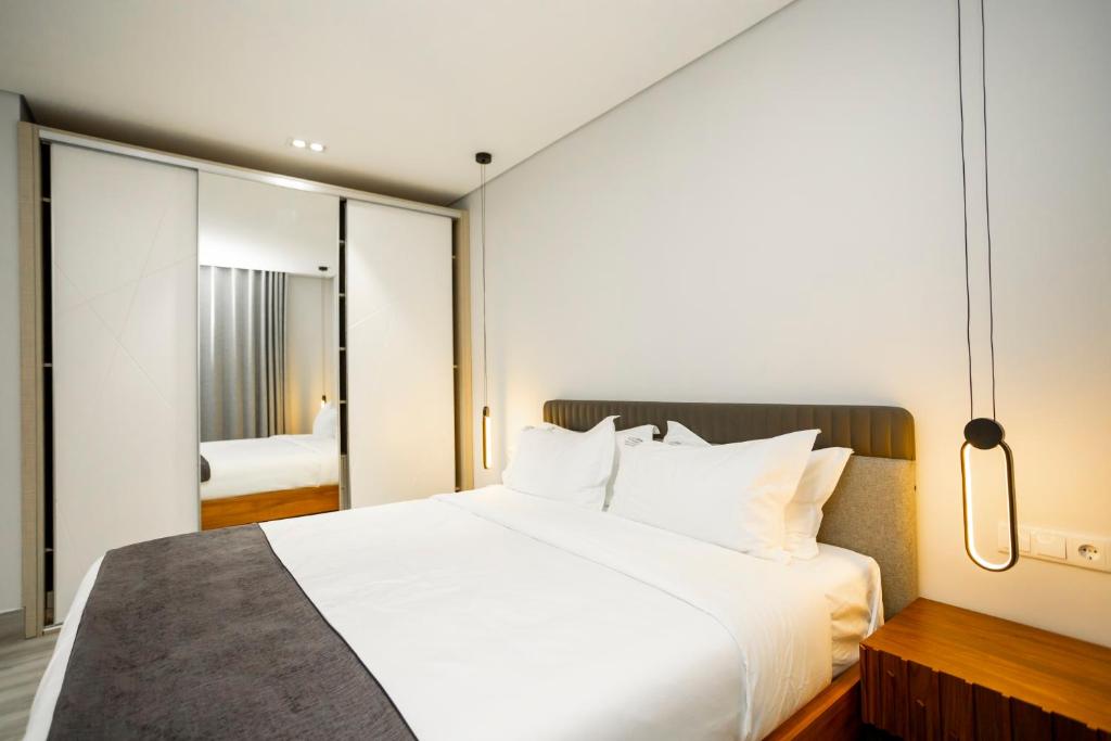 Postel nebo postele na pokoji v ubytování Space Quality Apart Hotel