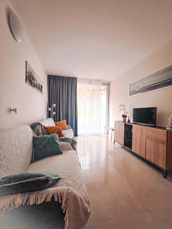 Posezení v ubytování Apartment Mare45 - 10 minutes walk from the beach with one private ombrella and two sun-beds