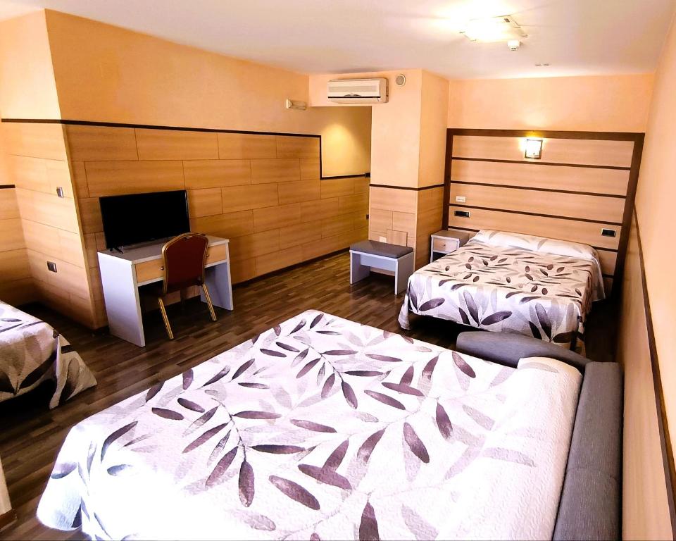 Postel nebo postele na pokoji v ubytování Hotel Pio XII Jumilla