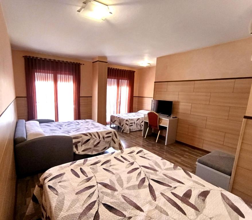Postel nebo postele na pokoji v ubytování Hotel Pio XII Jumilla