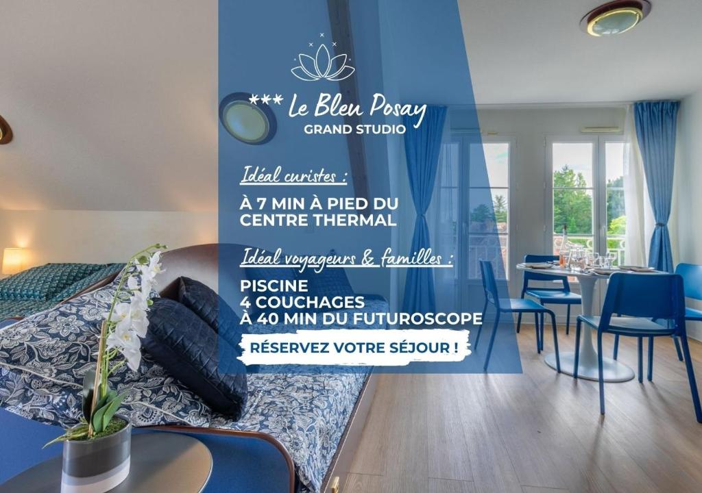 a bedroom with a bed with a wall with a sign at Grand Studio Le Bleu Posay in La Roche-Posay