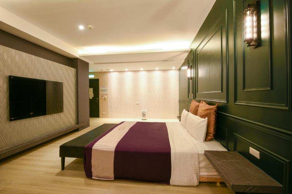 Postel nebo postele na pokoji v ubytování Belle Song Motel