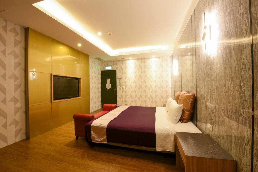 Postel nebo postele na pokoji v ubytování Belle Song Motel