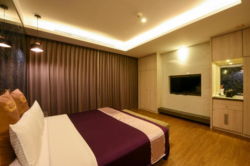 TV a/nebo společenská místnost v ubytování Belle Song Motel