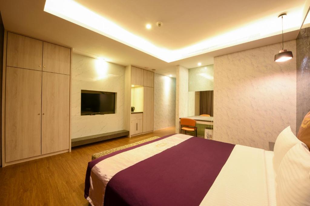 TV a/nebo společenská místnost v ubytování Belle Song Motel