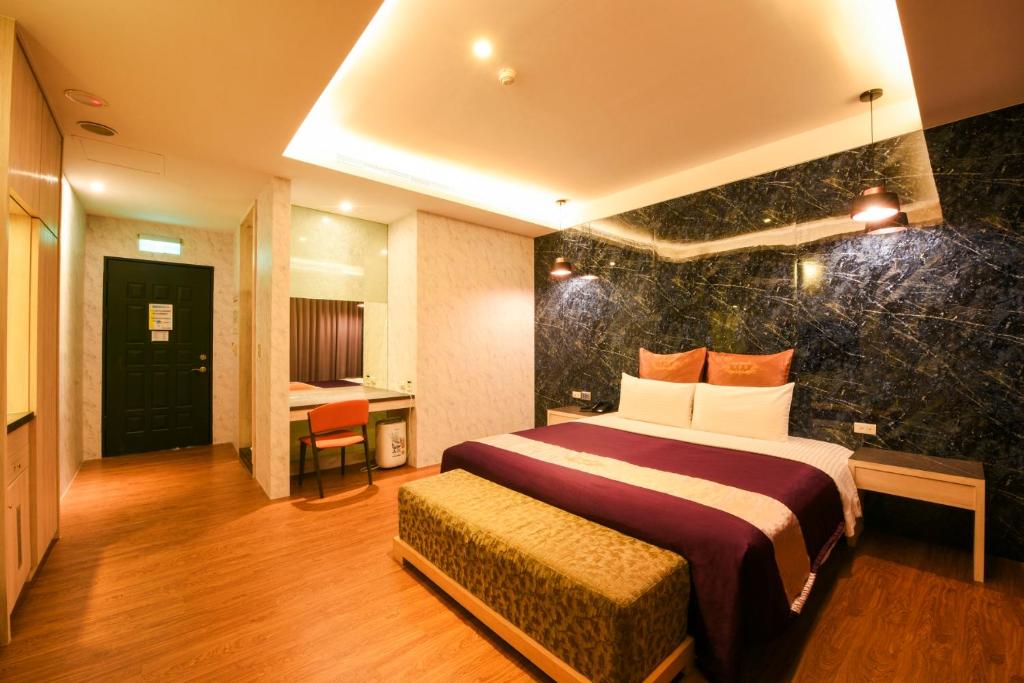 Postel nebo postele na pokoji v ubytování Belle Song Motel