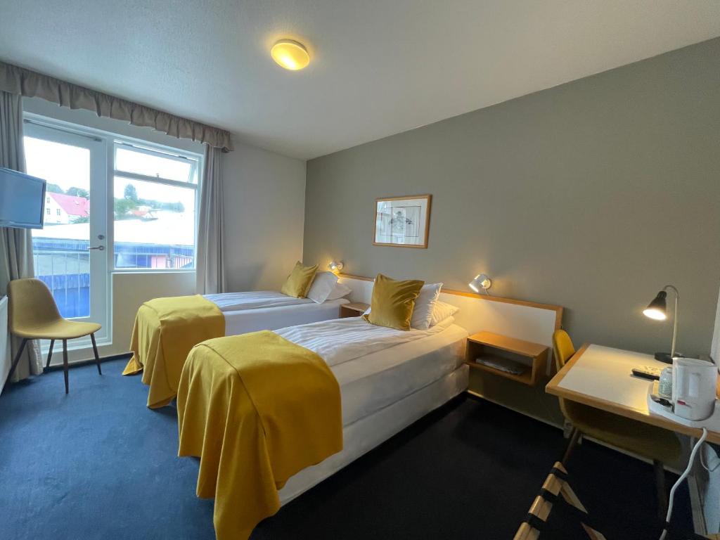 Posteľ alebo postele v izbe v ubytovaní Hotel Norðurland