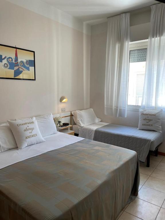 Postel nebo postele na pokoji v ubytování Hotel Soave