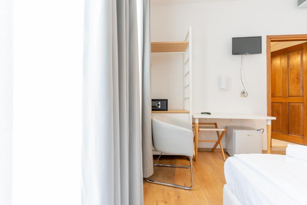 TV a/nebo společenská místnost v ubytování Hotel Regina