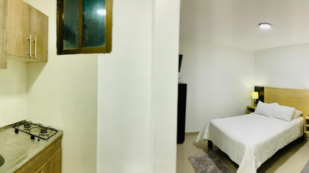 Postel nebo postele na pokoji v ubytování Apartahotel Bahia Tropical III