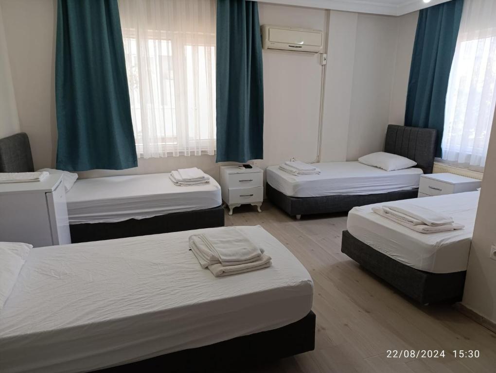 Postel nebo postele na pokoji v ubytování Odak Pansiyon