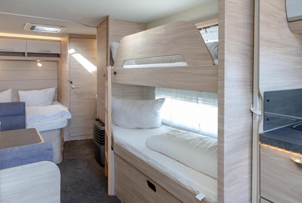 Postel nebo postele na pokoji v ubytování CAMPING SYLT am NSG Rantum-Becken