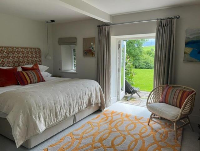 En eller flere senge i et værelse på Tregrylls Barton