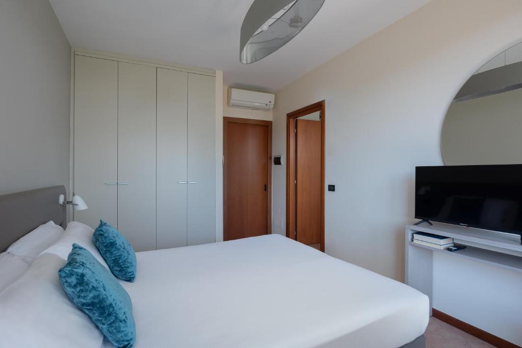 Łóżko lub łóżka w pokoju w obiekcie Il Sogno Apartments