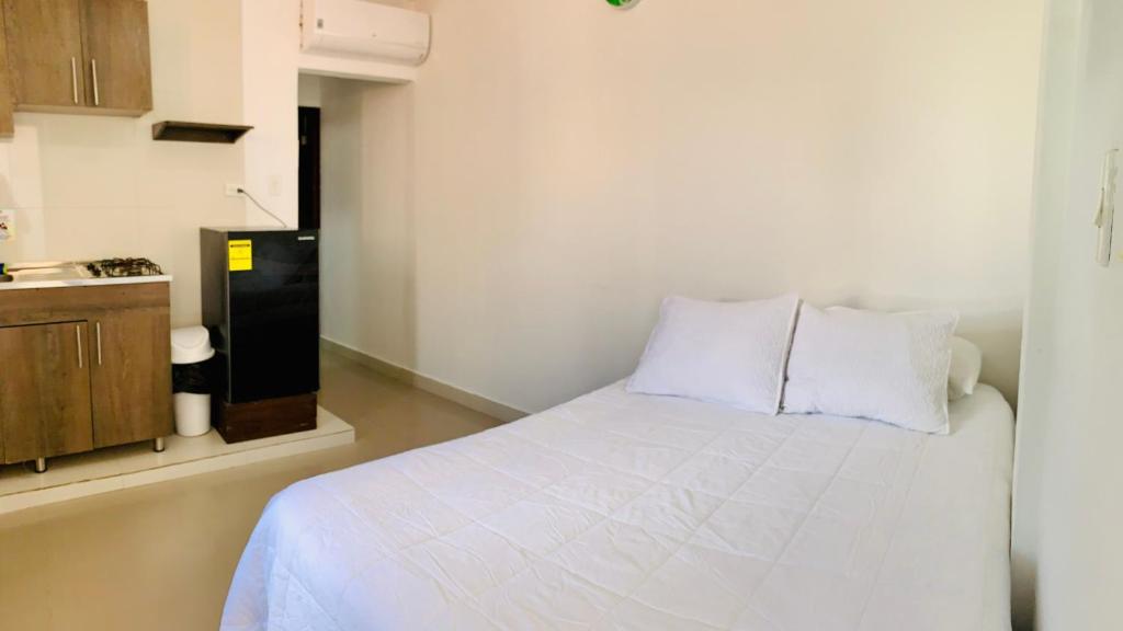 Postel nebo postele na pokoji v ubytování Apartahotel Bahia Tropical III