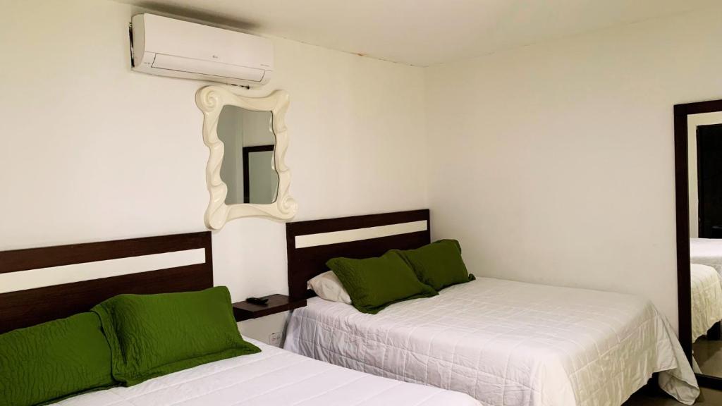 Postel nebo postele na pokoji v ubytování Apartahotel Bahia Tropical III