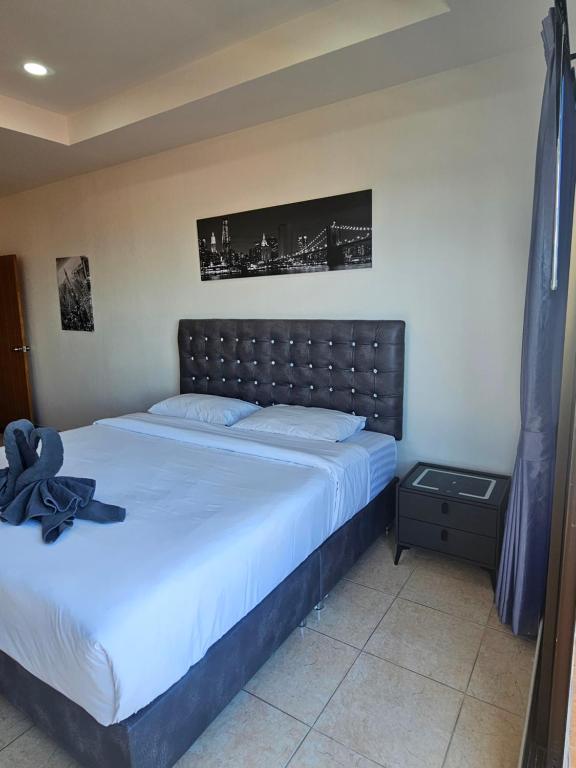 Postel nebo postele na pokoji v ubytování Candy Beach Seaview Jomtien